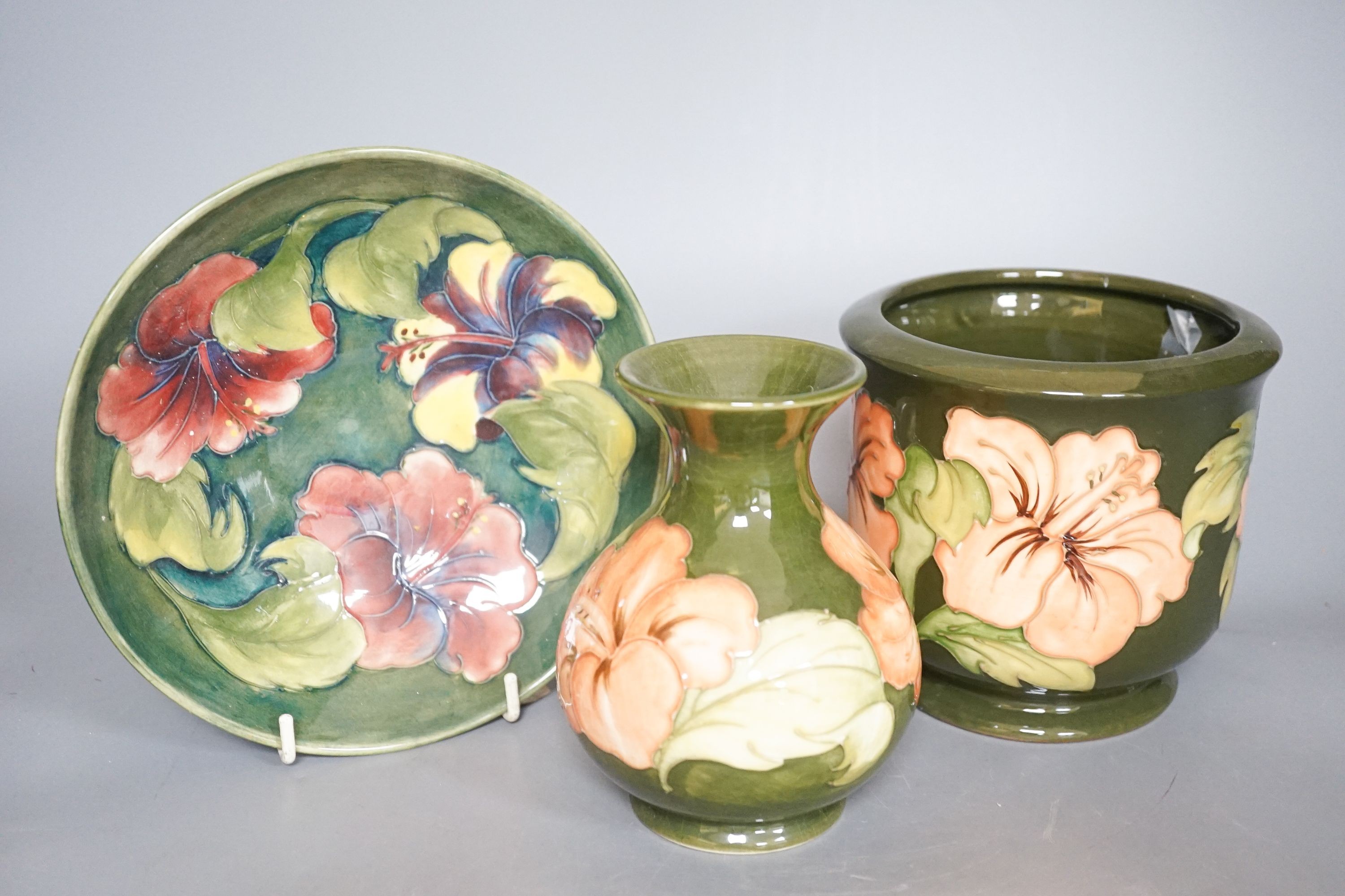 A Moorcroft hibiscus pattern vase, bowl and plant pot 19cm